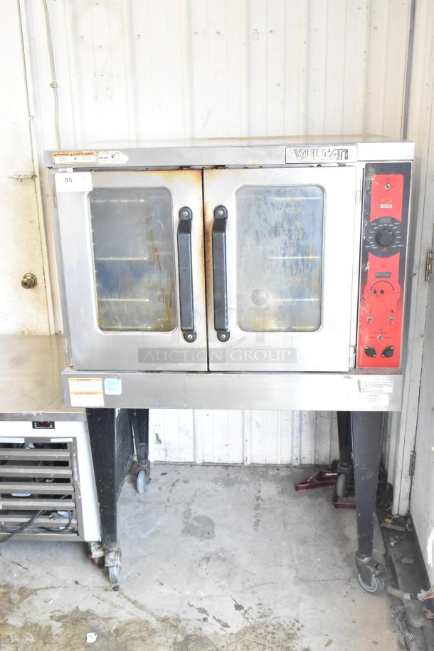 Vulcan commercial convection oven with view-through door, thermostatic controls, metal legs, on commercial casters; used condition.