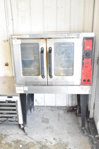 Vulcan commercial convection oven with view-through door, thermostatic controls, metal legs, on commercial casters; used condition.