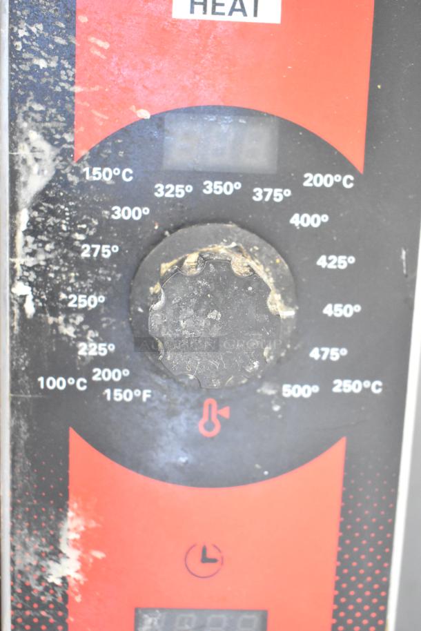 Vulcan convection oven thermostat panel showing temperature settings and control knob, visible wear, commercial use item.