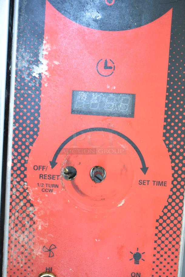 Red control panel of a Vulcan convection oven showing timer settings and switch labels for off/reset and set time.