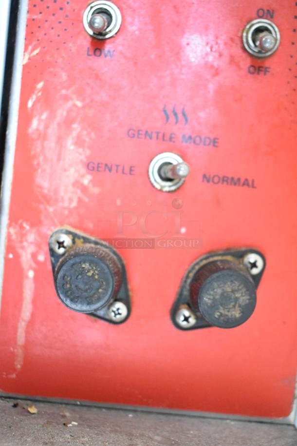 Red control panel of Vulcan convection oven, shows switches for 'Low', 'Gentle Mode', 'On/Off' functions.
