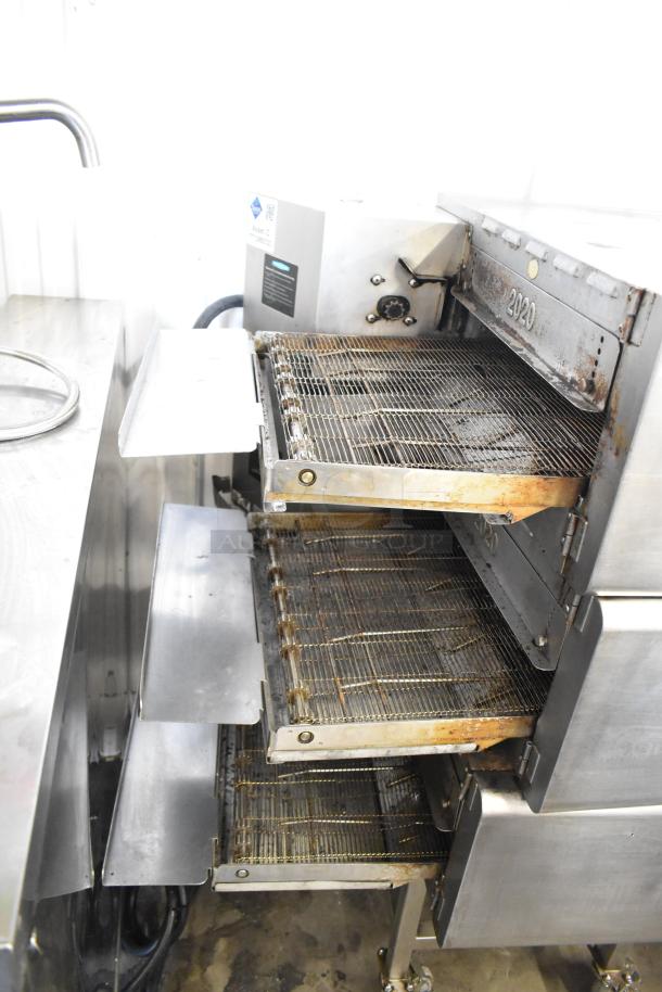 Turbochef HhC2020 commercial conveyor oven on stand with casters, 208/240V, 3-phase, visible wear, ideal for rapid cooking.
