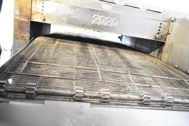 Turbochef HhC2020 electric conveyor rapid cook oven, visible wear, model number 2020 on unit.