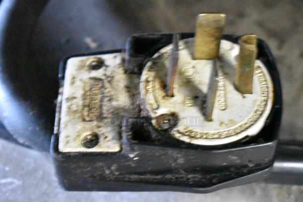 Close-up of a power plug for a Turbochef HhC2020 rapid cook oven, showing visible wear, 3-phase 208/240 volts.