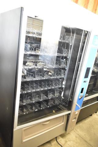 Crane 187D commercial floor vending machine, 115V, 1 phase, in used condition. Features snack spirals, glass front.