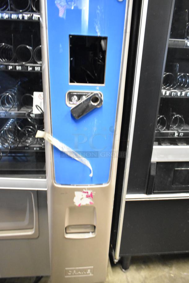 Crane 187D vending machine, commercial floor style, 115 volts, 1 phase, visible wear, coin slot, and product view window.