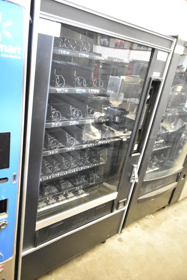 Crane 167 commercial vending machine, floor style, 115 volts, 1 phase, in used condition. Features spiral dispensers.