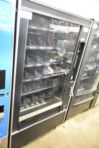 Crane 167 commercial vending machine, floor style, 115 volts, 1 phase, in used condition. Features spiral dispensers.