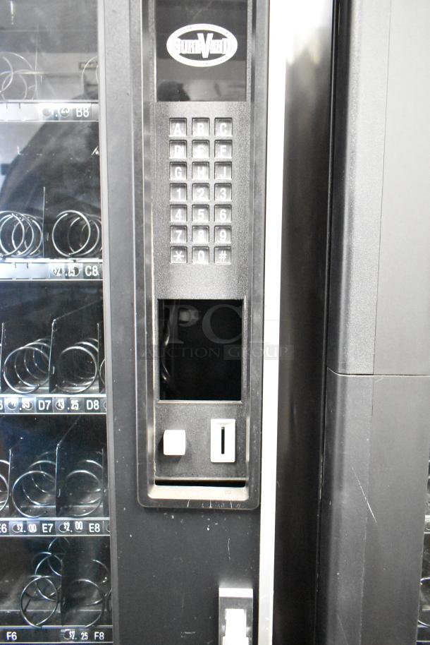Crane 167 commercial floor vending machine, 115 volts, keypad and coin slot visible, used condition.