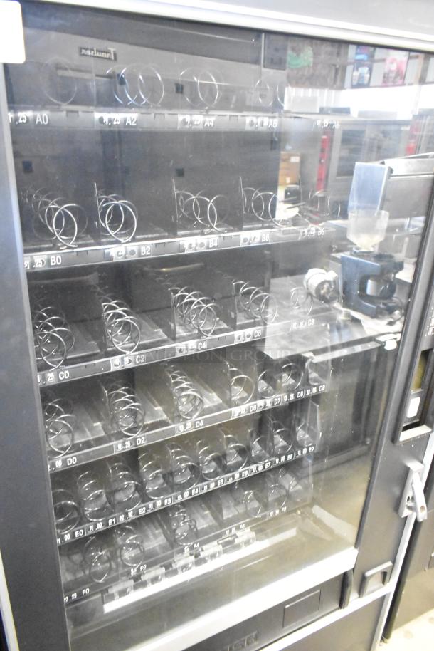 Crane 167 commercial vending machine, floor style, 115 volts, 1 phase, visible spirals, pre-owned condition.