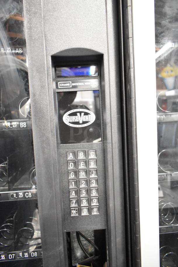 Crane 167 vending machine, keypad control, 115 volts, 1 phase, SureVend feature, commercial floor style, used condition.