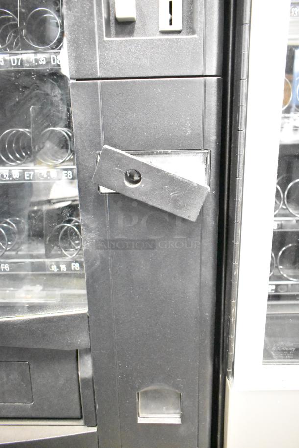 Crane 167 Commercial Floor Vending Machine, 115 Volts, 1 Phase, good condition, with visible coin slot and selection buttons.