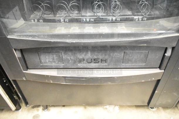 Crane 167 commercial vending machine, floor style, 115 volts, 1 phase, visible wear, push compartment; spiral mechanisms shown.