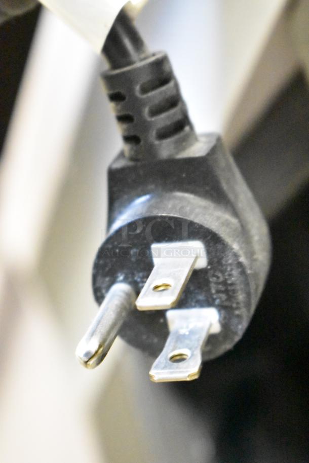 Crane 167 Floor Vending Machine plug, black, 115 volts, 1 phase, commercial use, showing standard prongs.