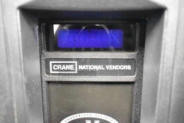 Crane 167 Commercial Floor Vending Machine, 115V, 1 Phase. Features Crane National Vendors label and electronic display.