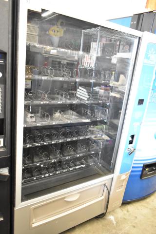 Crane 187D commercial vending machine, floor style, 115 volts, 1 phase, metallic finish, multiple spiral coils, clear front.