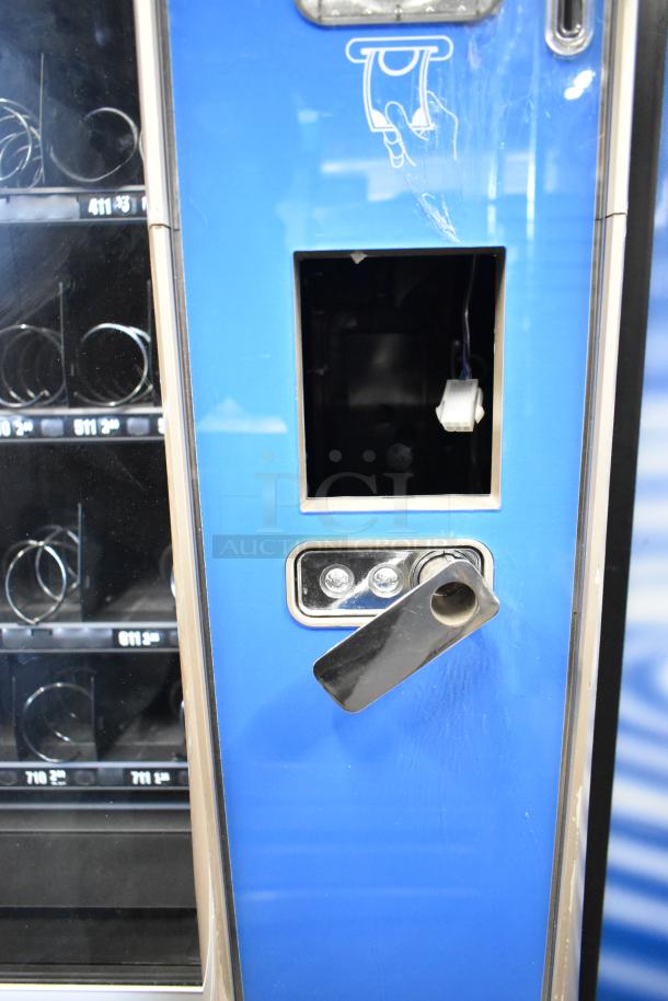 Crane 187D Floor Vending Machine, 115V, 1 Phase. Blue exterior, coin slot detail visible. Good condition.