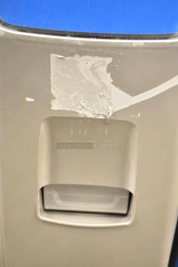 Crane 187D commercial vending machine, 115V, 1 Phase. Floor style, visible surface wear, and adhesive residue.