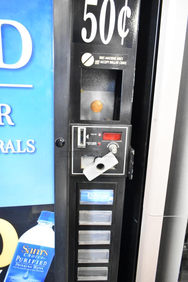 Commercial floor-style vending machine, coin-operated at 50¢, 115 volts, 1 phase, selling purified water.