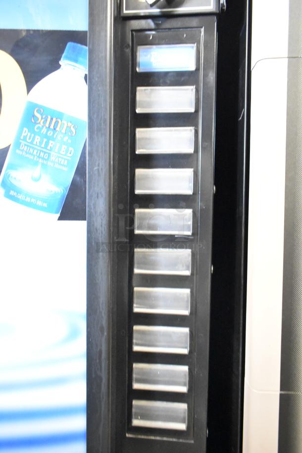 Commercial floor style vending machine, 115 volts, 1 phase, with multiple product selection buttons and Sam's Choice branding.