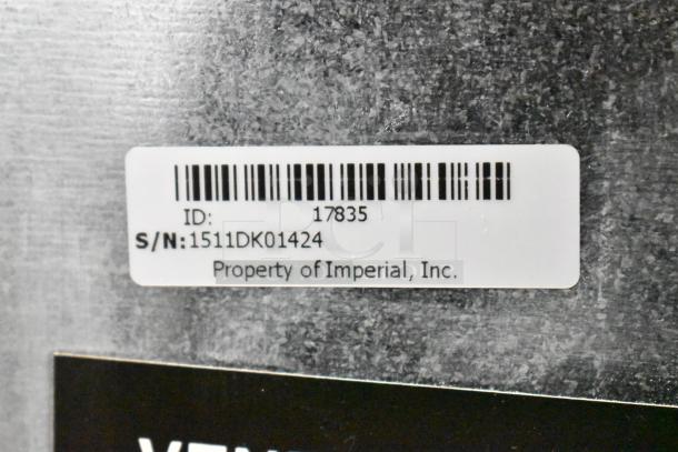 Barcode label on commercial vending machine. ID: 17835, S/N: 1511DK01424, marked as property of Imperial, Inc.