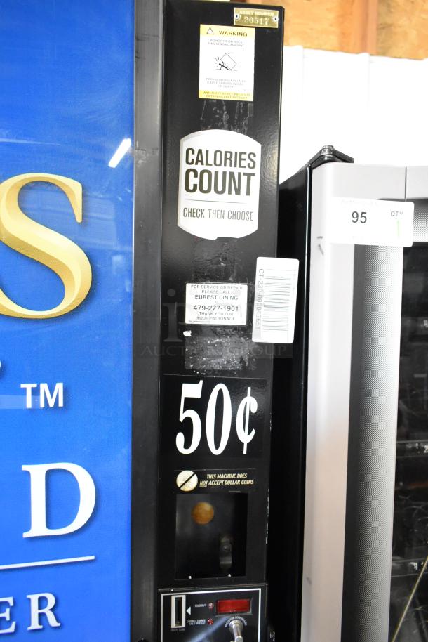 Commercial floor-style vending machine, 115 volts, 1 phase. Markings indicate a 50¢ price. “Calories Count” and service label visible.