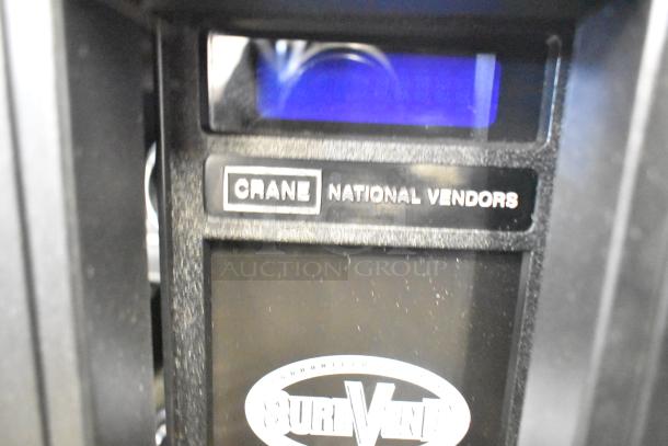 Crane 167 Commercial Vending Machine, 115V, 1 Phase, features Crane brand label, SureVend logo, suitable for high-traffic areas.