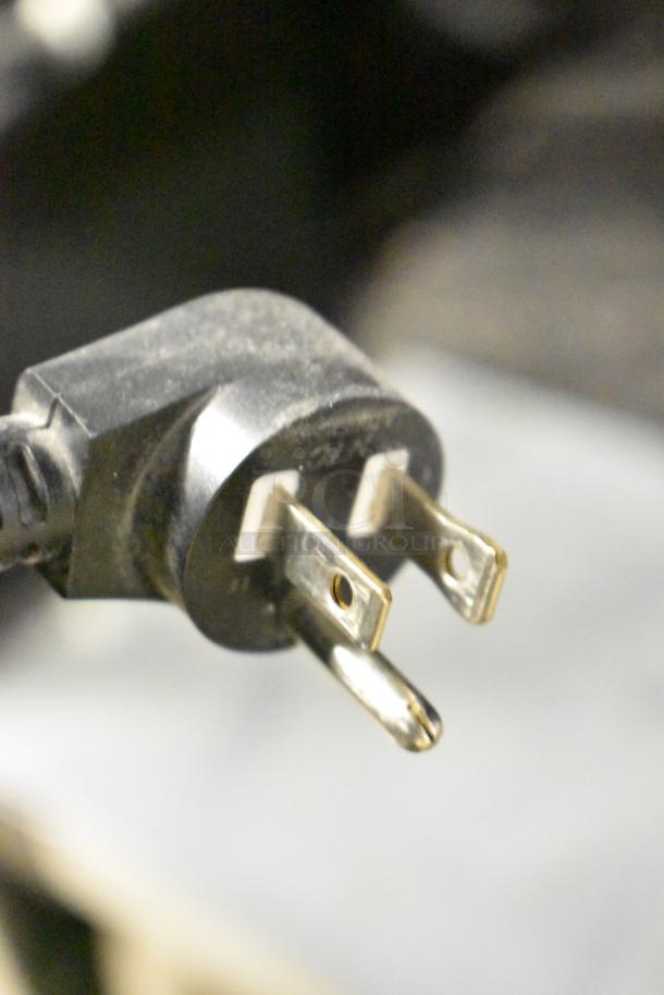 Plug for Crane 167 Commercial Floor Vending Machine, 115 Volts, 1 Phase, showing a three-prong cord in good condition.