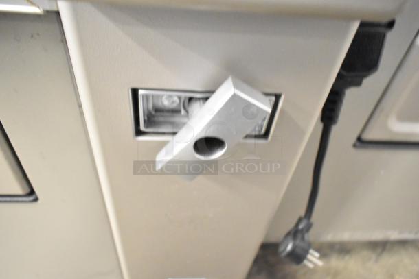 Crane 181 commercial floor-style vending machine, 115 volts, 1 phase; features durable build, visible power plug.