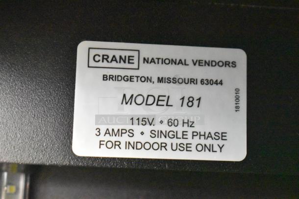 Crane 181 vending machine label showing model, 115 volts, 60 Hz, 3 amps, single phase details, for indoor use.