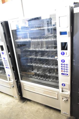 Crane 181 Commercial Floor Vending Machine, 115 Volts, 1 Phase, glass front, multiple shelves, keypad interface.