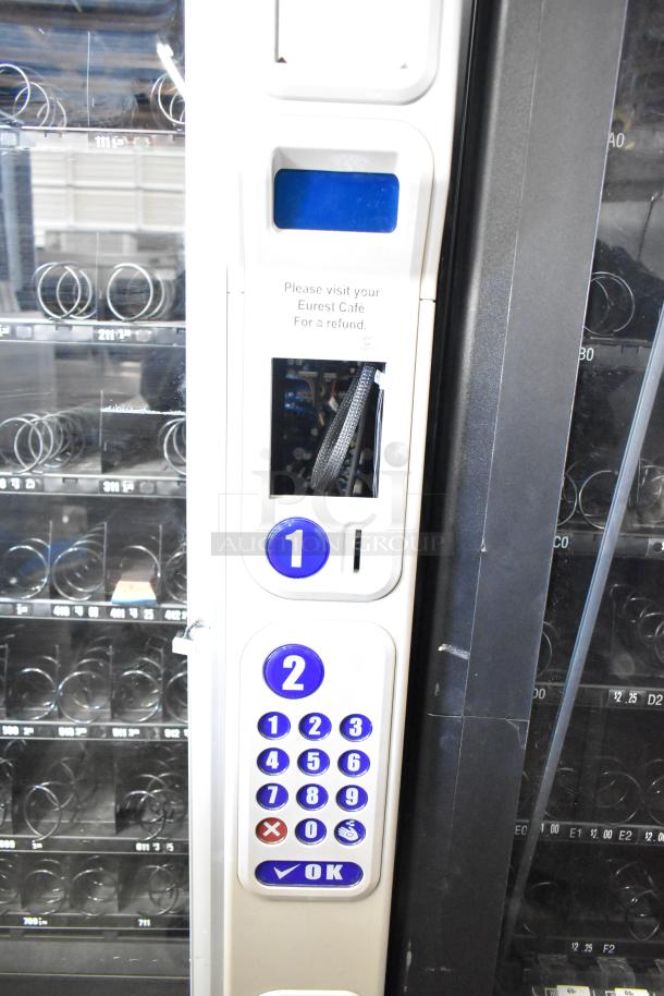 Crane 181 commercial floor vending machine, 115 volts, 1 phase. Keypad and pricing labels visible. Excellent condition.