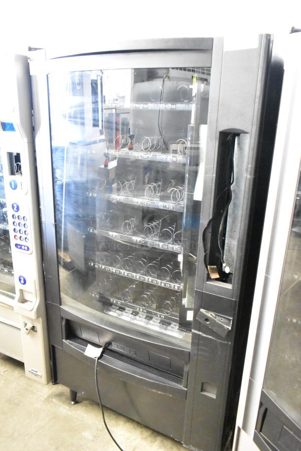 Crane 167 commercial vending machine, floor style, 115V, 1 phase, black exterior, visible spiral slots.