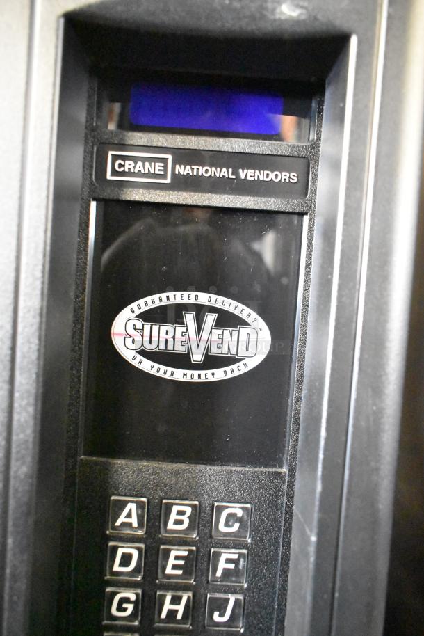 Crane 167 Commercial Floor Vending Machine, 115 Volts, 1 Phase, SureVend label, keypad visible.
