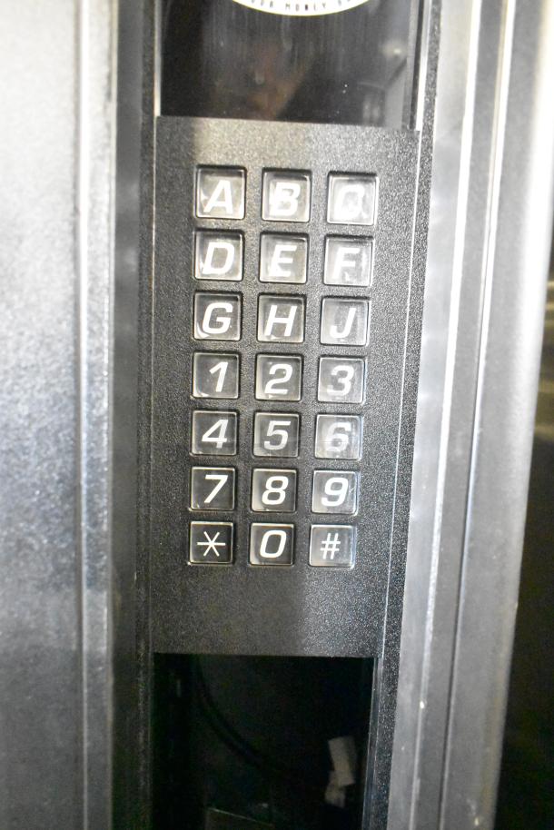 Crane 167 Commercial Floor Vending Machine featuring keypad controls, 115 volts, 1 phase. Keypad has A-J, 0-9 functions.