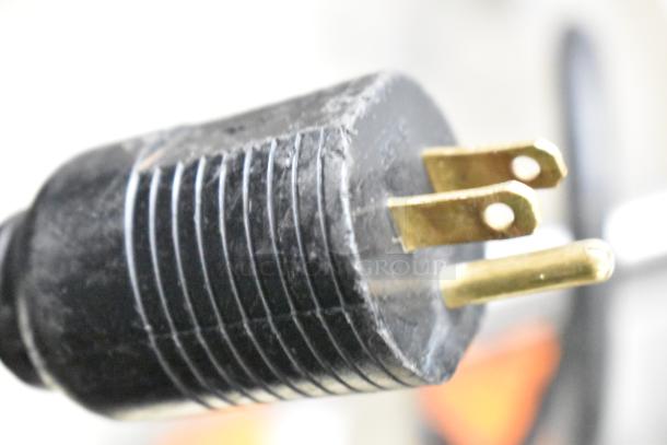 The image shows a close-up of a three-pronged power plug of the JBT Fresh N Squeeze Juicer.