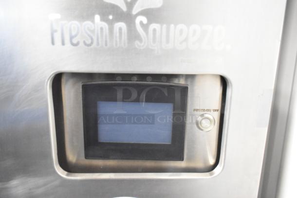 JBT Fresh N Squeeze commercial citrus juicer with digital display. Stainless steel, on casters, 115V, 1 phase.