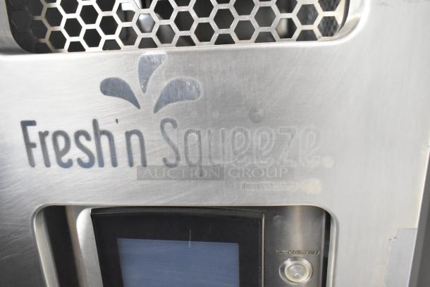 JBT Fresh N Squeeze commercial citrus juicer, floor model, stainless steel finish, on casters, 115 volts, 1 phase.