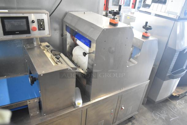 Commercial floor-style multi-roll dough sheeter on casters, stainless steel, 230 volts, digital control panel, excellent condition.