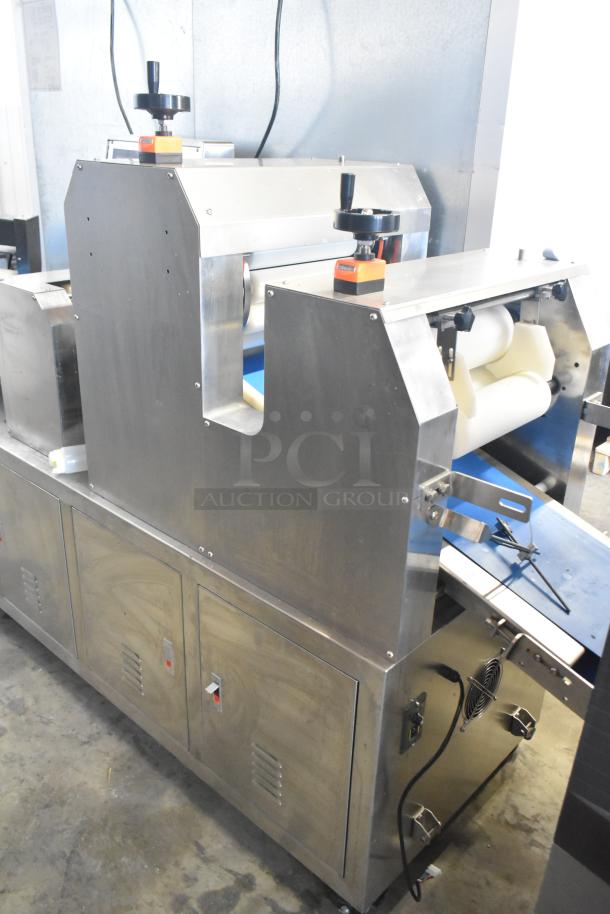 Commercial floor-style multi-roll dough sheeter on casters, stainless steel, 230 volts, includes control knobs and visible wiring.