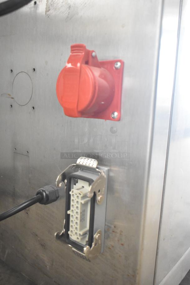 Commercial dough sheeter with electrical connections, stainless steel body, and commercial casters, 230 volts.