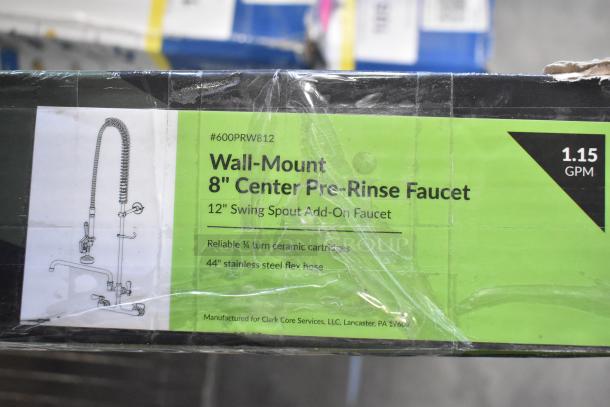BRAND NEW Regency 600PRW812 wall-mounted pre-rinse faucet, 1.15 GPM, 8" centers, 12" add-on faucet, visible packaging.