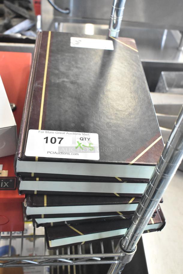 Five National account books with black covers, gold stripe, and auction label "107 QTY x5". Suitable for financial records.