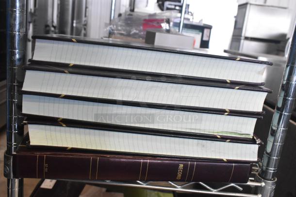 Stack of five National Account Books with lined pages and black covers, in good condition. Visible label reads "Record."