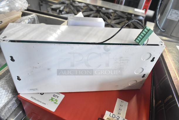 Altronix box in white, includes wiring and connectors. Visible wear marks. "PCI Auctions" label indicates quantity of 2.