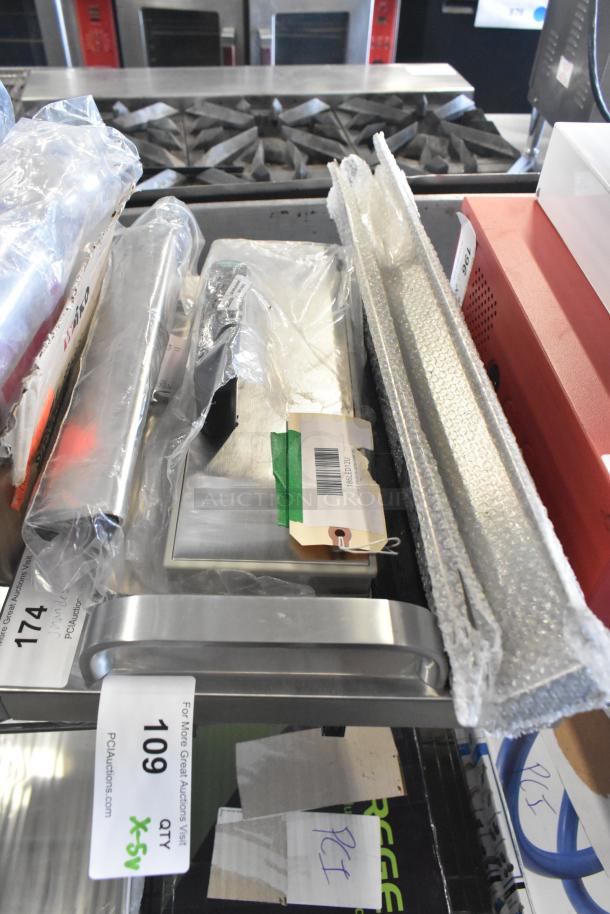 Set of 5 items including VacPak-It 186LED12U lid for UVME12SS, wrapped in plastic and bubble wrap, auction tags visible.