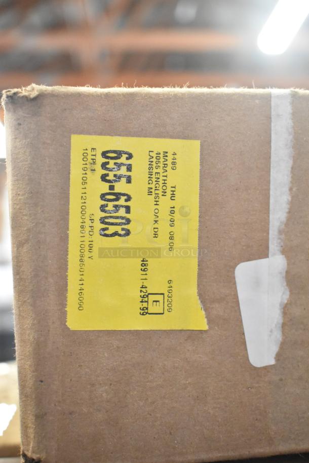 Cardboard box with a yellow label showing numbers and address information. Contains auction items like Hoshizaki 4A4865-01 Thermistor-Defrost and Cambro TG6110 Tongs.