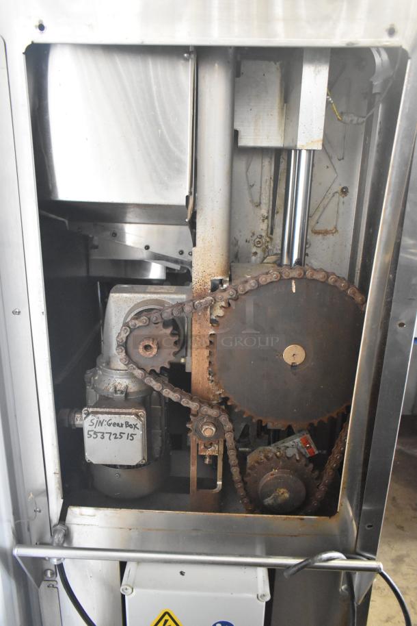 JBT 2ND-GEN-MFJ-HE Citrus Juicer, commercial floor style, visible gears and motor, 115 volts, on casters.