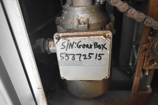 JBT Fresh N Squeeze citrus juicer gearbox with handwritten serial number 55372515. Rust visible, indicating wear.