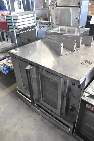 Garland SunFire gas convection oven with view-through doors, thermostatic controls, metal legs; well-maintained.